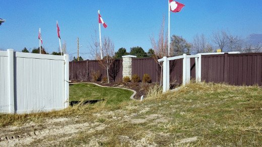 PVC Vinyl fencing is gone with the wind A Trex fence in the background is still standing while a PVC vinyl fence in front has been blown out due to high winds.