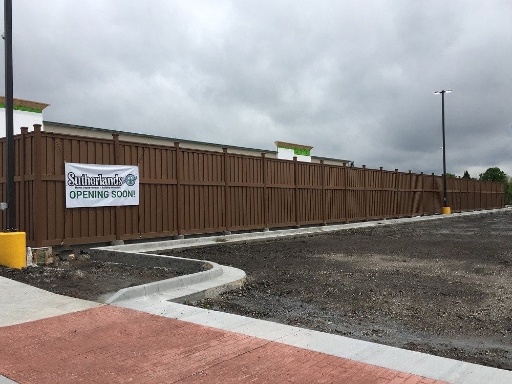 sutherlands-commercial-yard-olathe-ks A tall perimeter built from Trex Fencing