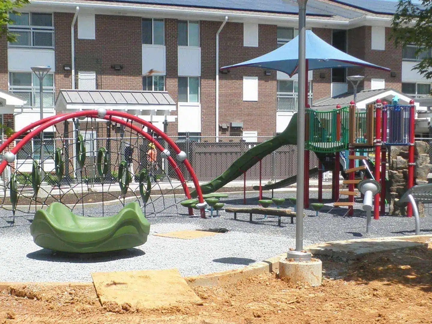 Trex Fencing and Playground A playground in front of a Trex Seclusions Fence at the Parkway Overlook Apartments complex in Washington DC