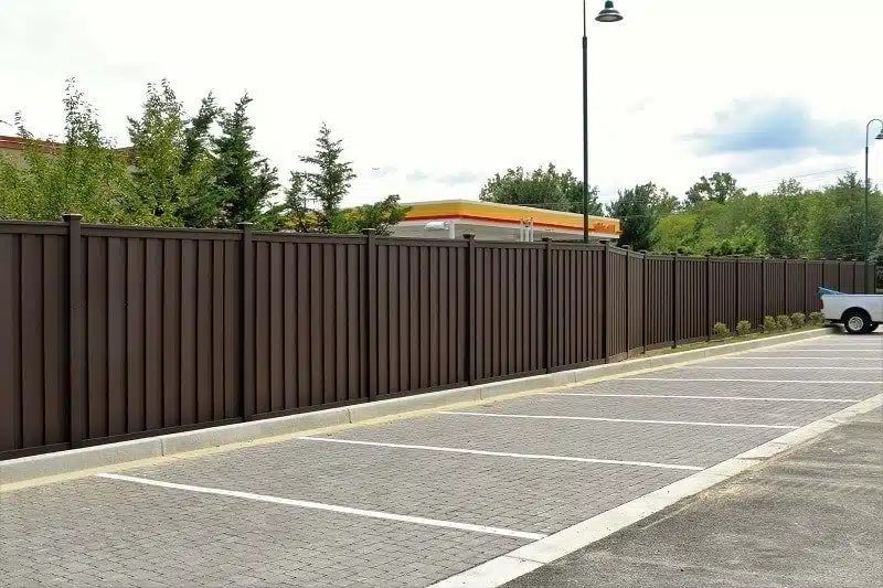 Trex Fencing around Goddard School Parking Lot An 8 foot tall Trex Fence next to the Goddard School parking lot in Ellicott City, Maryland.