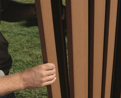 An installer building a Trex Fence