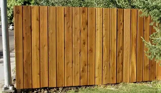 board-on-board-wood-fence A wood fence with pickets overlapping to create a board-on-board look.