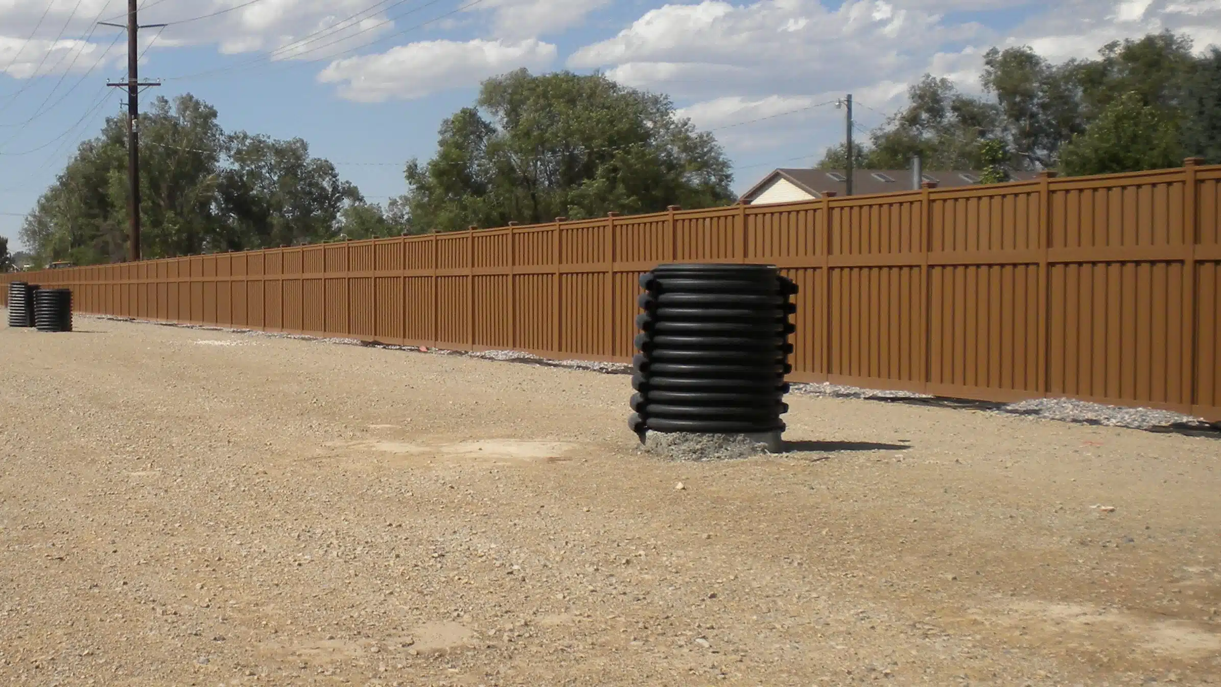 government-fencing-by-trex A long perimeter of Trex fencing installed for a government fencing project